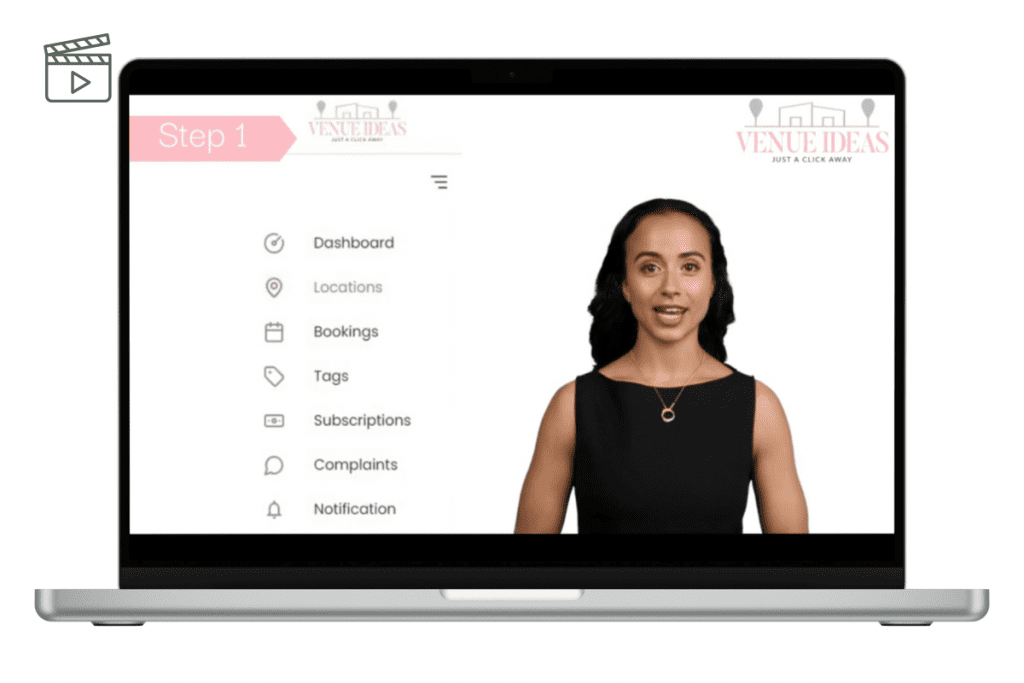 A laptop displaying a woman on the screen, set against a neutral background.