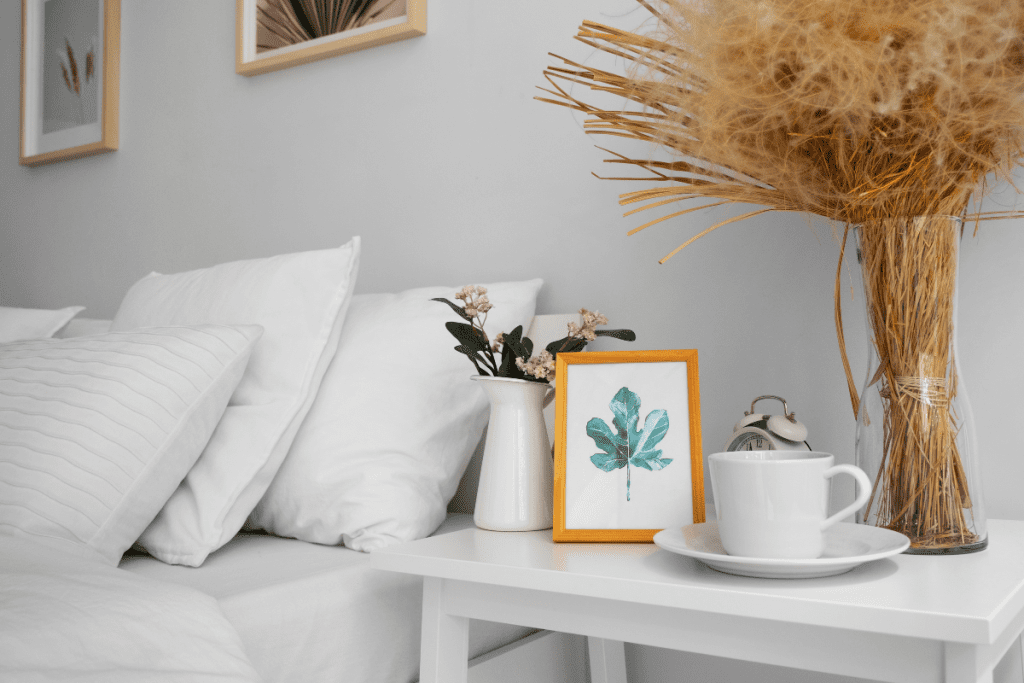 A neatly made bed with white sheets and pillows, creating a clean and inviting sleeping space.